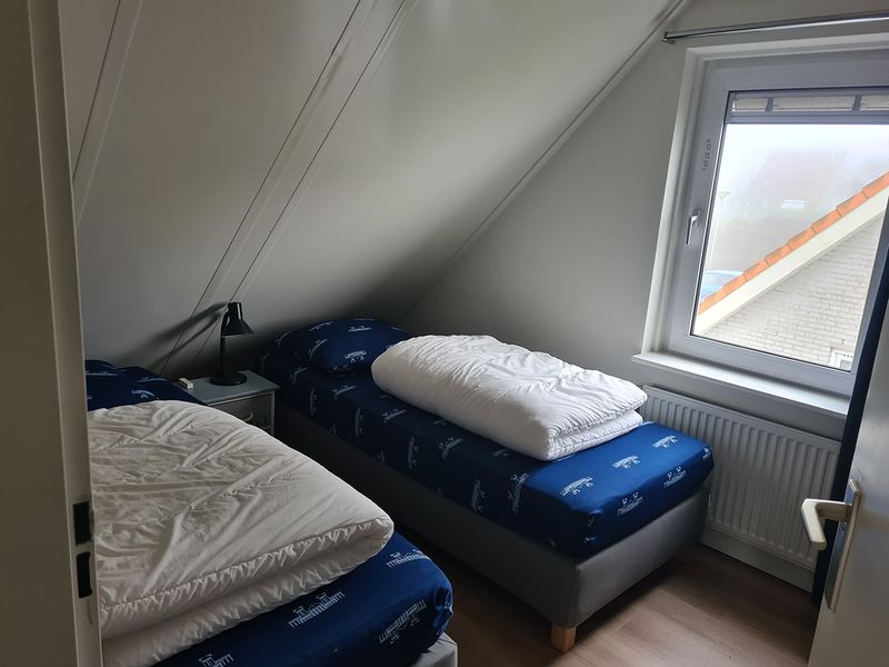 Slaapkamer met uitzicht op de weilanden